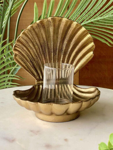 Sea shell with a glass candle holder inside